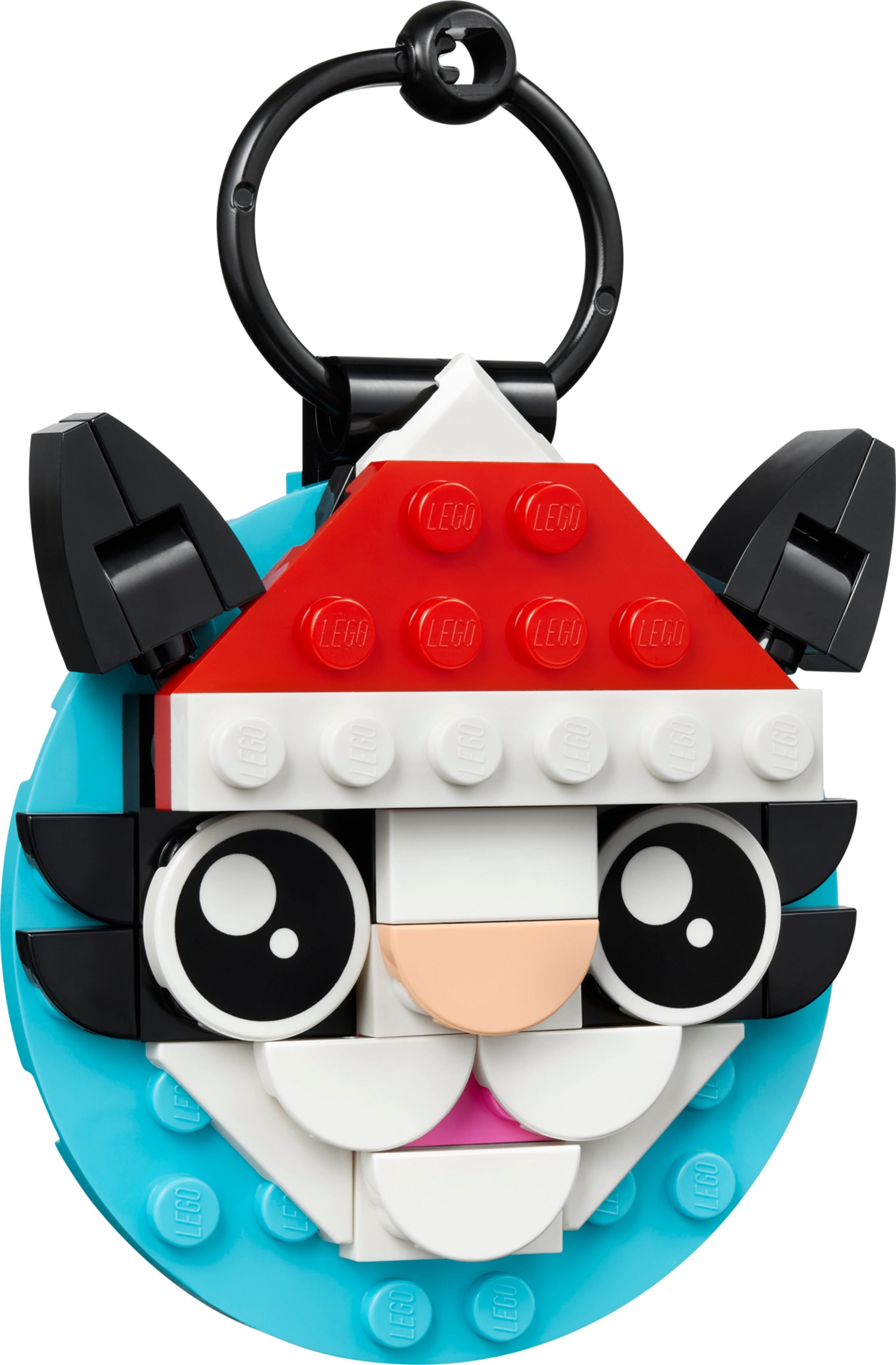La décoration en forme de chat au bonnet de Noël sur son disque turquoise