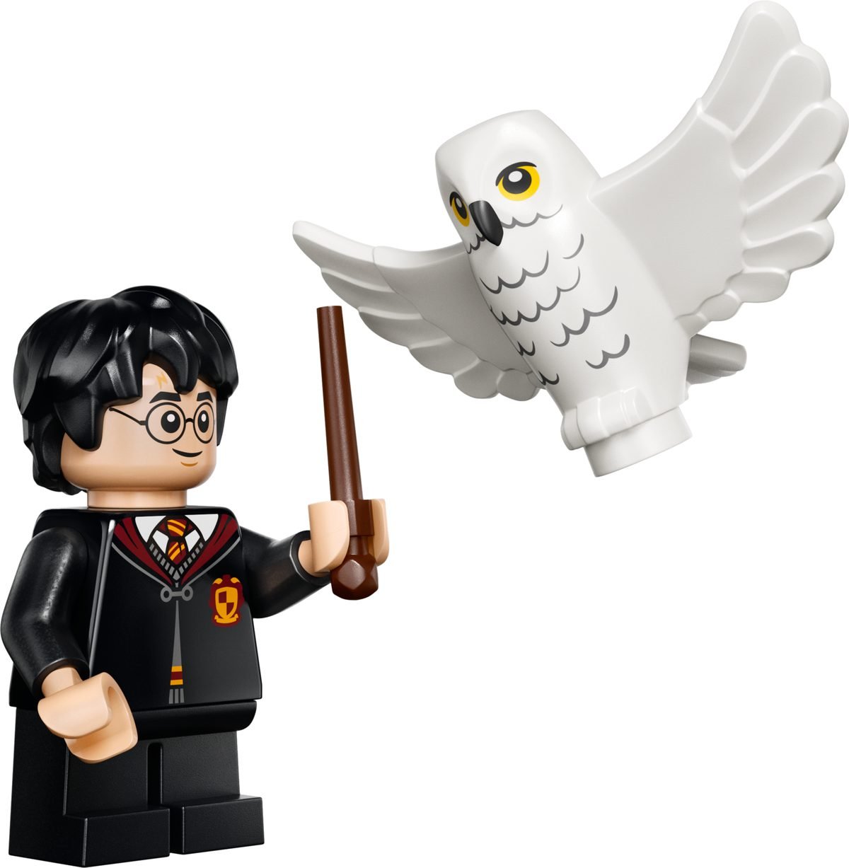 La minifigurine de Harry Potter avec sa baguette et l'élément Hedwige fournis dans le set LEGO 40975