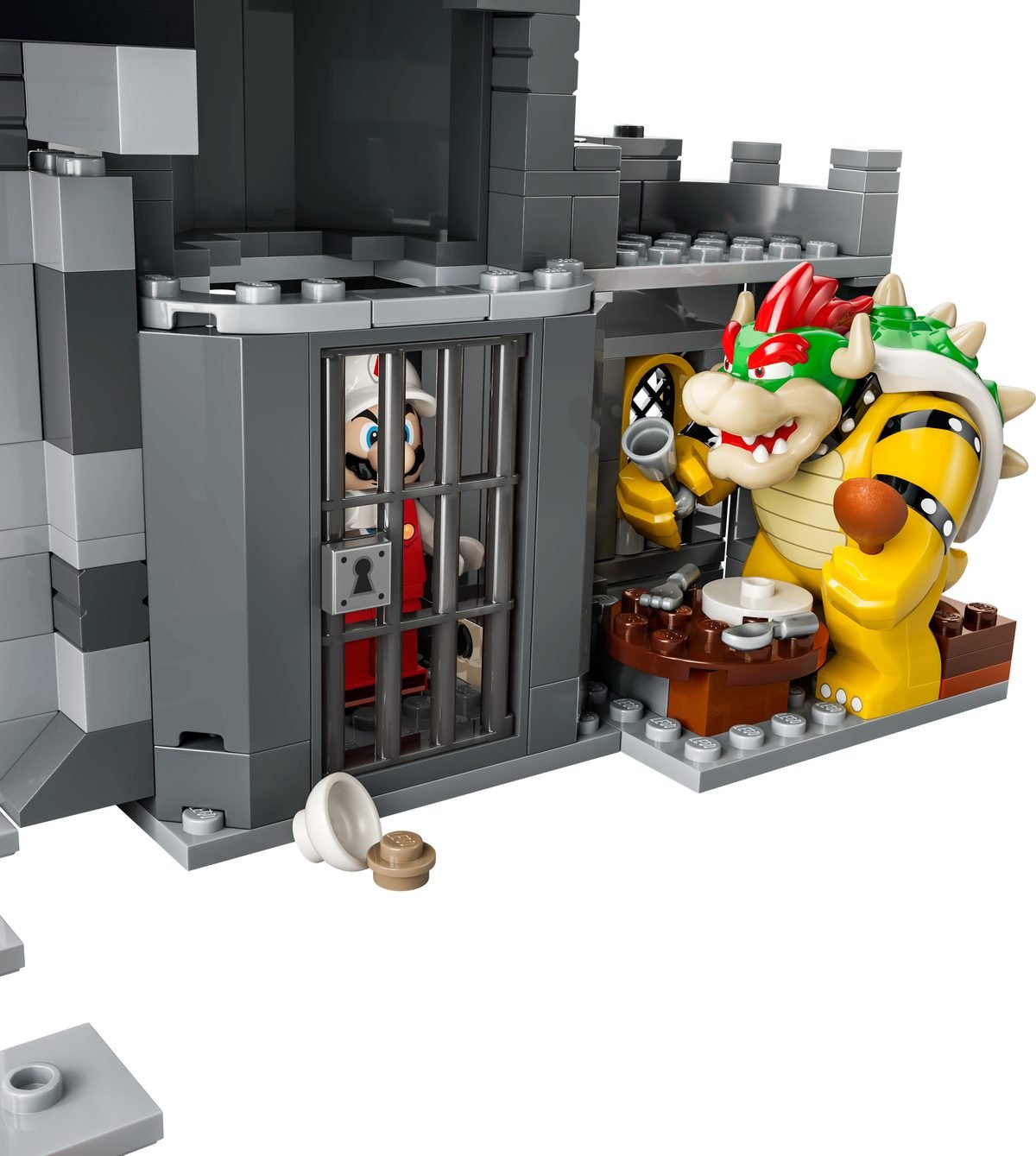 Le cachot du set 72060, Mario de feu derrière les barreaux pendant que Bowser passe à table